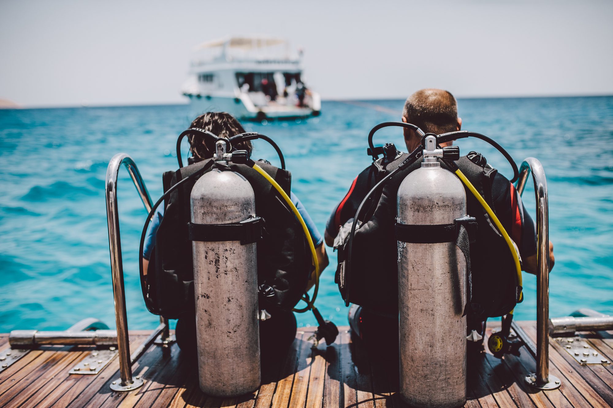 Divers exploring coral reefs safely